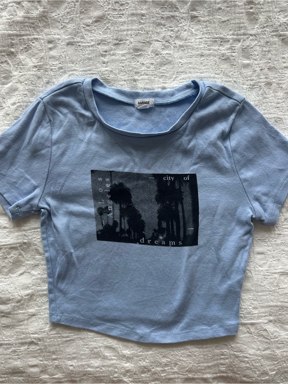 Light blue garage baby tee. “City of dreams” Gently worn